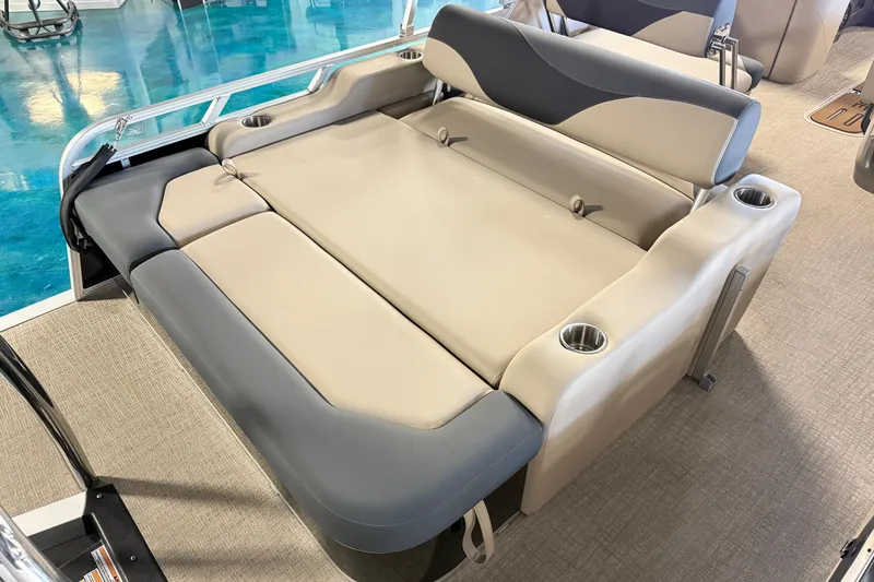 Slide: The Image of 2026 Tahoe Pontoon LTZ Entertainer with luxurious seating and cup holders. - 3