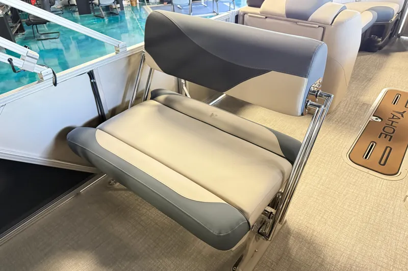 Slide: The Image of 2026 Tahoe Pontoon LTZ Entertainer boat seat with sleek gray and beige design. - 4