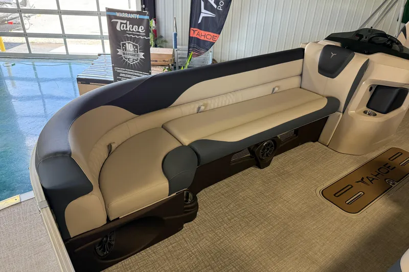 Slide: The Image of 2026 Tahoe Pontoon LTZ Entertainer interior with beige and black seating. - 8