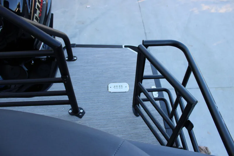 Slide: The Image of 2026 Starcraft SLS 3 boat deck with black railings and textured flooring. - 10