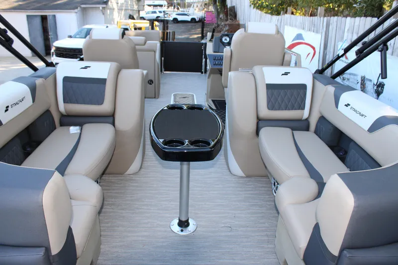 Slide: The Image of 2026 Starcraft SLS 3 boat interior with luxurious seating and central table. - 11
