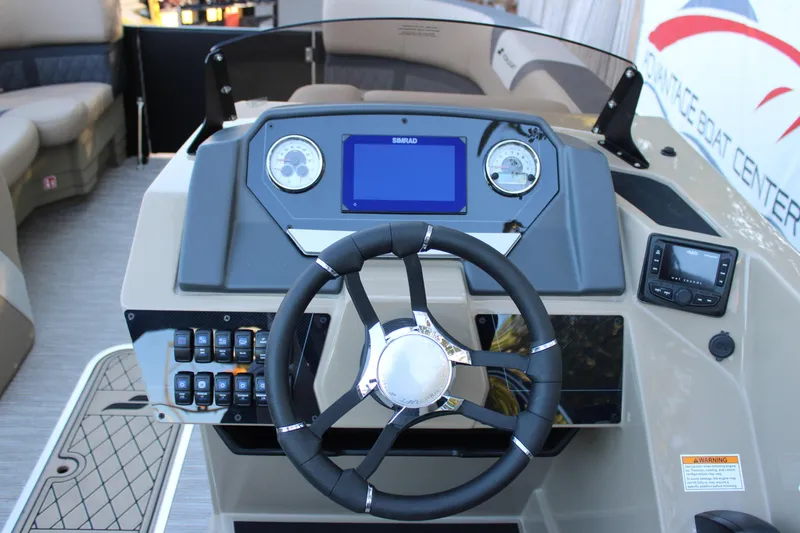 Slide: The Image of 2026 Starcraft SLS 3 boat dashboard with steering wheel and control panel. - 13