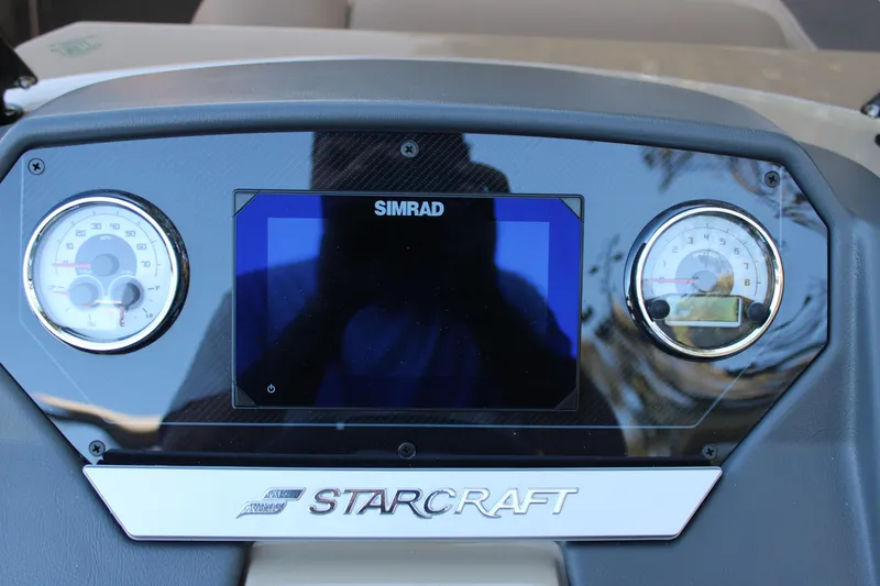 Slide: The Image of Dashboard of 2026 Starcraft SLS 3 boat with Simrad display and gauges. - 14