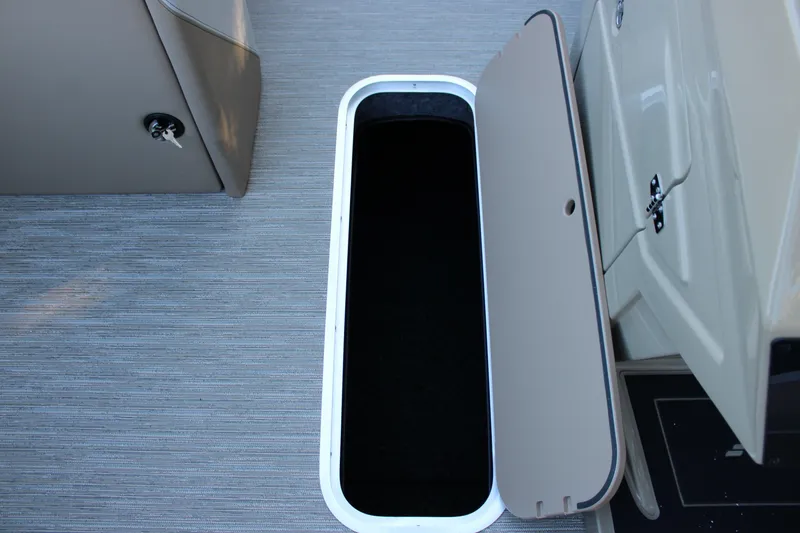 Slide: The Image of Open storage compartment on 2026 Starcraft SLS 3 boat, featuring sleek interior design. - 21