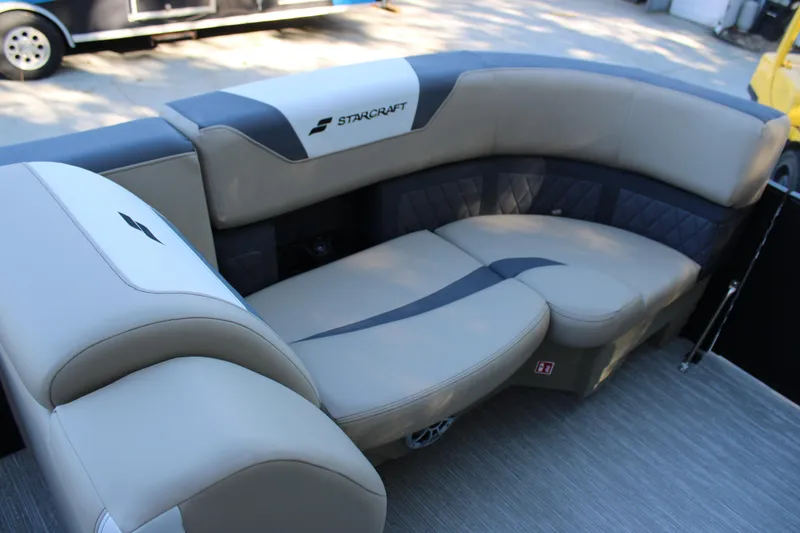 Slide: The Image of Luxurious seating in 2026 Starcraft SLS 3 boat, featuring elegant beige and gray upholstery. - 24