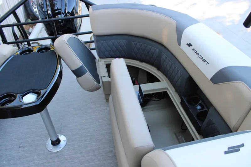 Slide: The Image of 2026 Starcraft SLS 3 boat interior with cushioned seating and table with cup holders. - 28