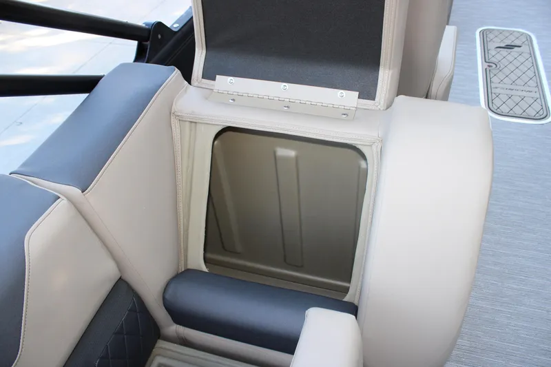 Slide: The Image of Open storage compartment in 2026 Starcraft SLS 3 boat with beige and gray seating. - 32