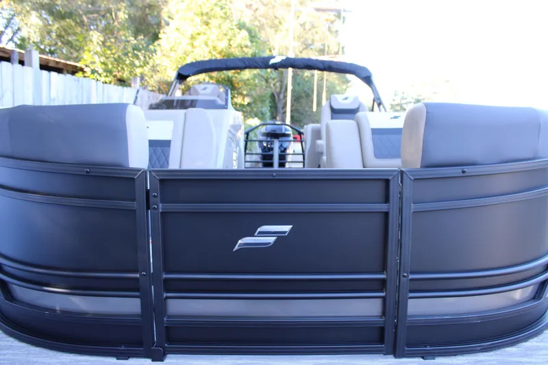 Slide: The Image of 2026 Starcraft SLS 3 pontoon boat with sleek black exterior and comfortable seating. - 35