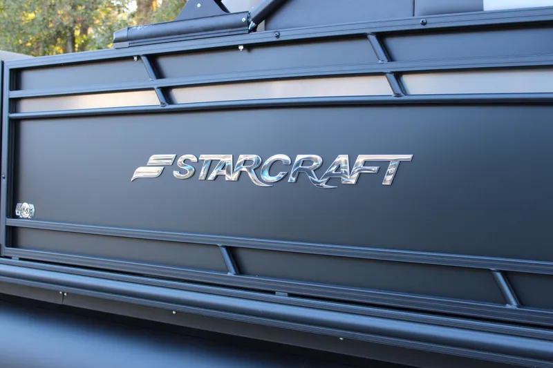 Slide: The Image of 2026 Starcraft SLS 3 boat with sleek black design and chrome logo. - 36