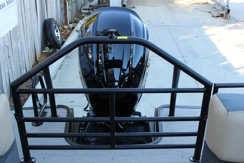 Slide: The Image of Rear view of 2026 Starcraft SLS 3 boat with sleek black motor and railing. - 8