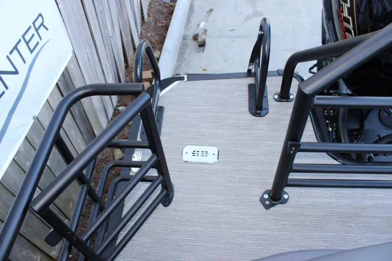 Slide: The Image of 2026 Starcraft SLS 3 boat deck with safety railings and motor view. - 9