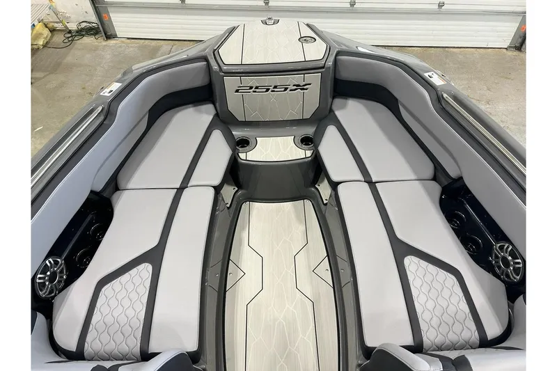 Slide: The Image of 2025 Yamaha Boats 255XE interior with sleek seating and modern design. - 7