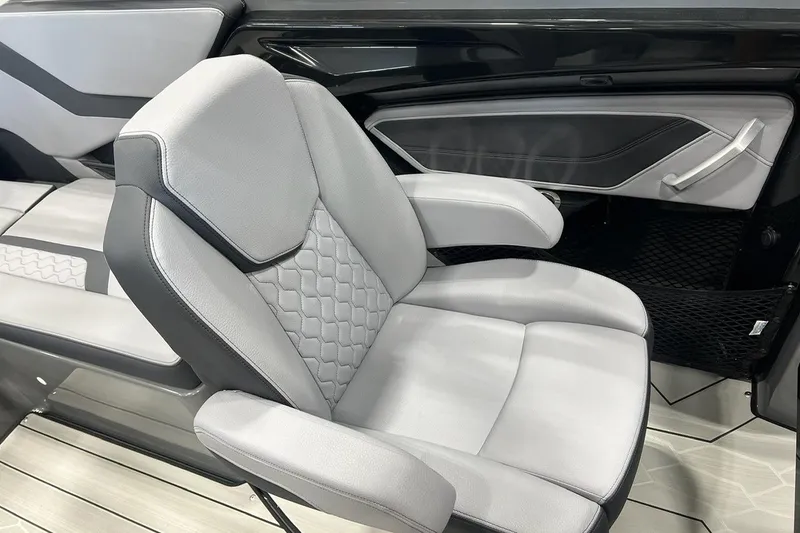 Slide: The Image of 2025 Yamaha Boats 255XE interior with luxurious gray seating and modern design. - 8