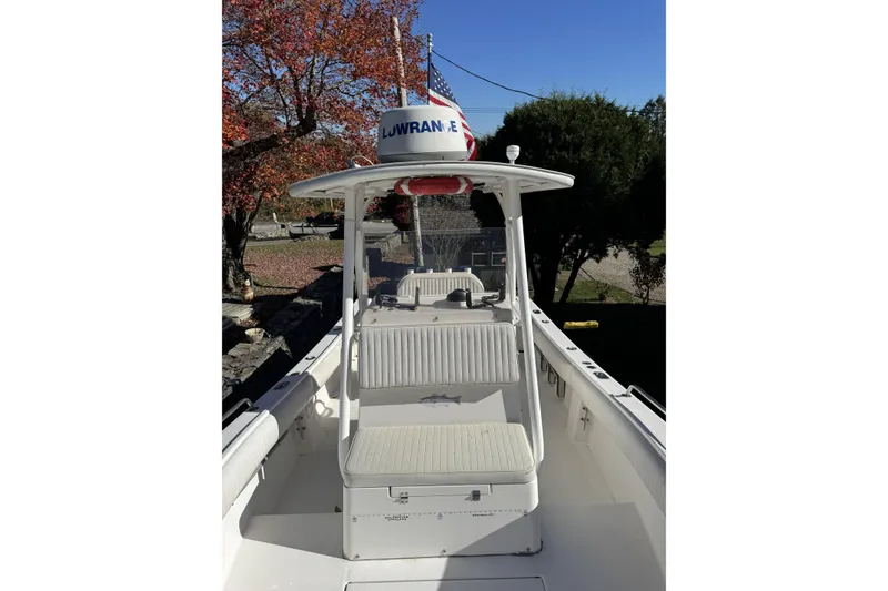 Slide: The Image of 2004 Regulator 24 Forward Seating boat with Lowrance radar, autumn backdrop. - 15