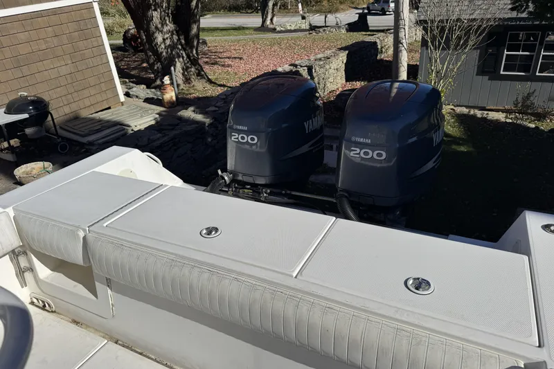 Slide: The Image of 2004 Regulator 24 Forward Seating boat with twin Yamaha 200 engines. - 21