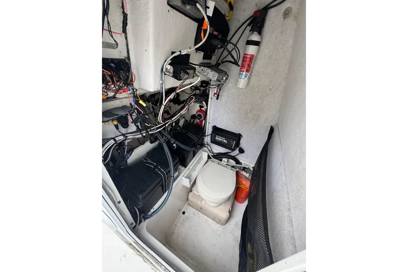 Slide: The Image of 2004 Regulator 24 Forward Seating boat interior with wiring and equipment. - 29
