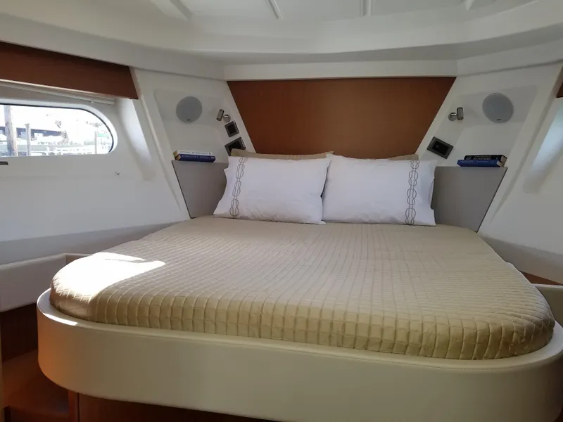 Slide: The Image of Luxurious bedroom in 2019 Beneteau Swift Trawler 35 with cozy bedding and modern design. - 48