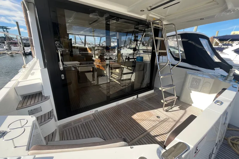 Slide: The Image of 2019 Beneteau Swift Trawler 35, featuring a spacious deck and modern interior design. - 8