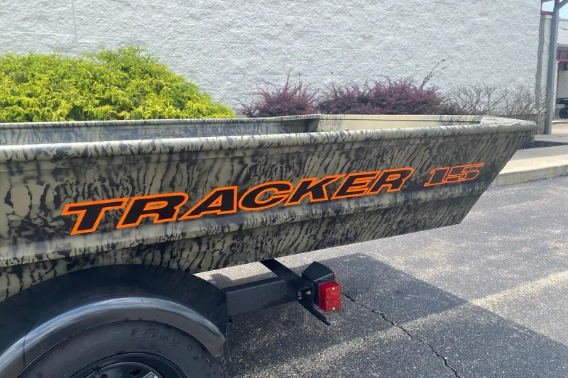 The Image of 2026 Tracker Grizzly 15 Jon boat with camouflage design and bold orange lettering. - 0