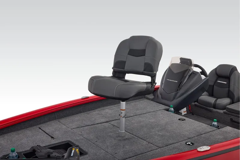 Slide: The Image of 2026 Tracker Pro Team 190 boat interior with storage compartment and cup holders. - 17