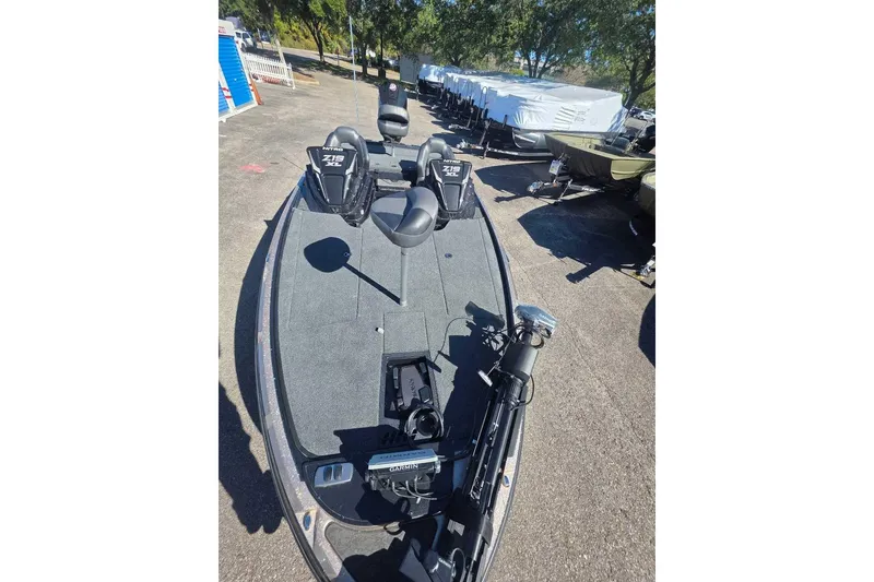 Slide: The Image of 2026 Nitro Z19 XL Pro fishing boat with advanced Garmin equipment, parked outdoors. - 3