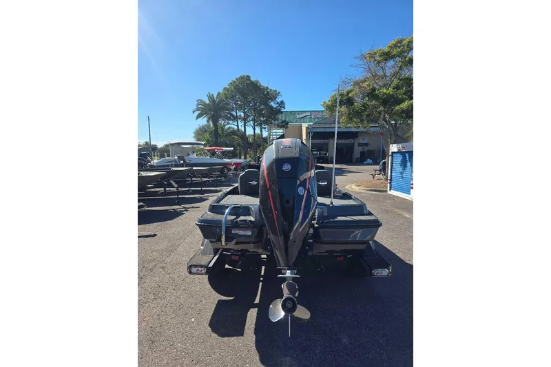 Slide: The Image of 2026 Nitro Z19 XL Pro boat with outboard motor in a sunny outdoor setting. - 4