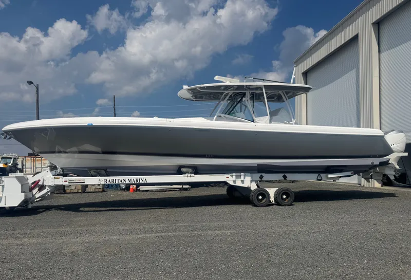 Slide: The Image of 2019 Intrepid 475 Panacea on a trailer in front of a building. - 0