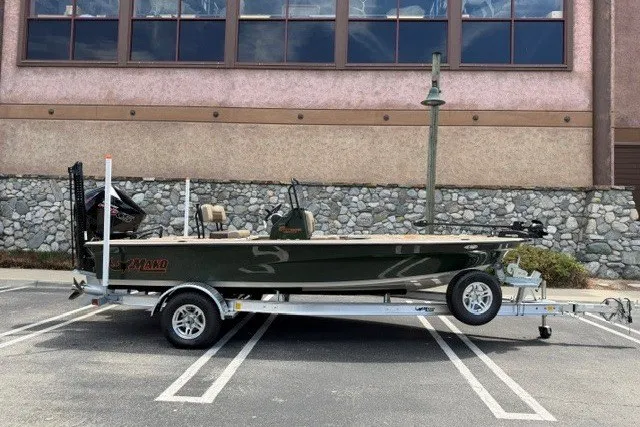 The Image of 2026 Mako 18 Pro Skiff Backwater Edition on trailer in parking lot. - 0