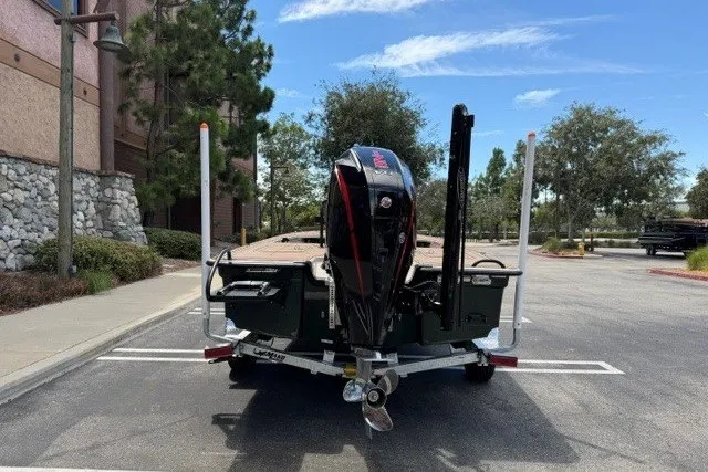 Slide: The Image of 2026 Mako 18 Pro Skiff Backwater Edition on trailer, parked outdoors. - 7