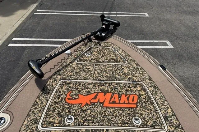 Slide: The Image of 2026 Mako 18 Pro Skiff Backwater Edition with camo deck and trolling motor. - 8