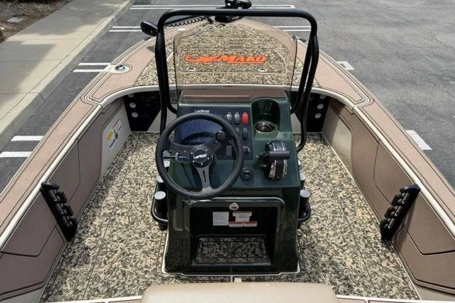 Slide: The Image of 2026 Mako 18 Pro Skiff Backwater Edition boat interior with steering console. - 10