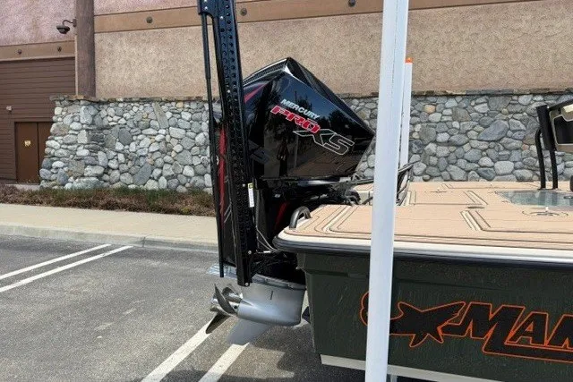 Slide: The Image of 2026 Mako 18 Pro Skiff Backwater Edition with Mercury Pro XS engine in parking lot. - 6
