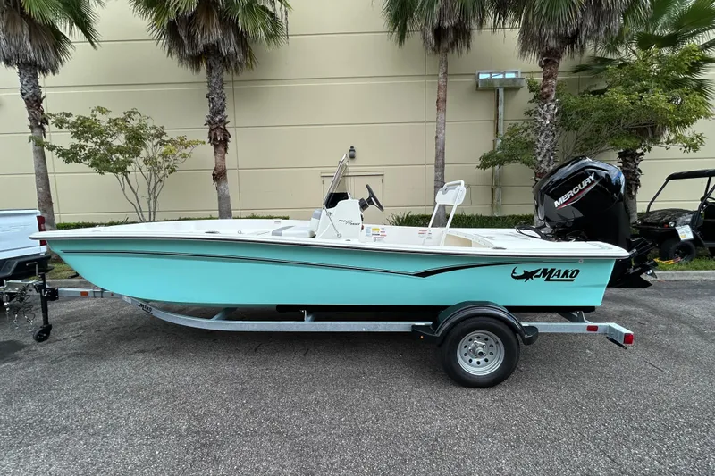 The Image of 2026 Mako Pro Skiff 17 CC boat on trailer, parked outdoors. - 0
