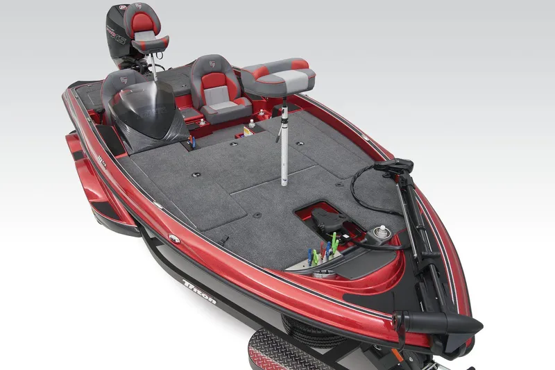 Slide: The Image of 2025 Triton 18 TrX boat cockpit with steering wheel and control panel. - 5