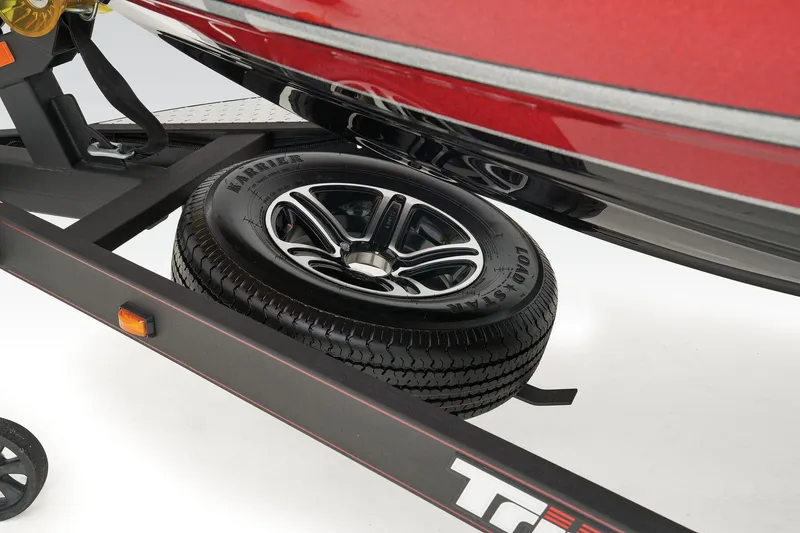 Slide: The Image of 2025 Triton 18 TrX boat interior with dual seats and steering wheel. - 9