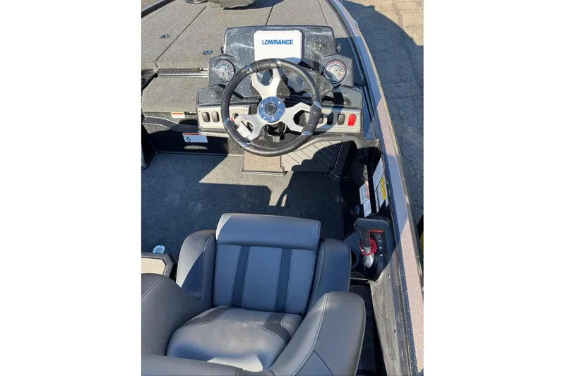 Slide: The Image of 2026 Nitro Z19 XL boat interior with steering wheel and dashboard controls. - 11