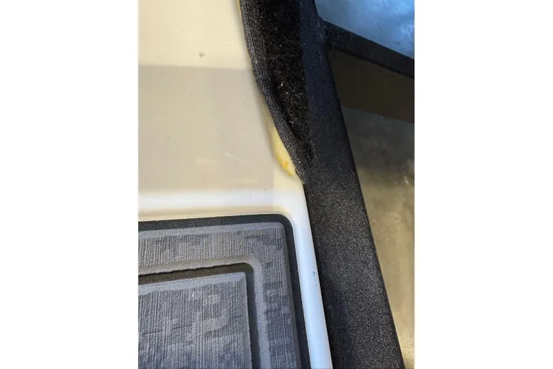 Slide: The Image of Close-up of 2026 Nitro Z19 XL boat interior detail, showing carpet and paneling. - 88