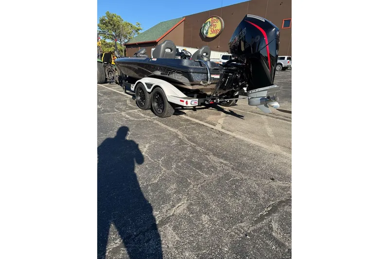 Slide: The Image of 2026 Nitro Z19 XL boat parked outside Bass Pro Shops on a sunny day. - 98