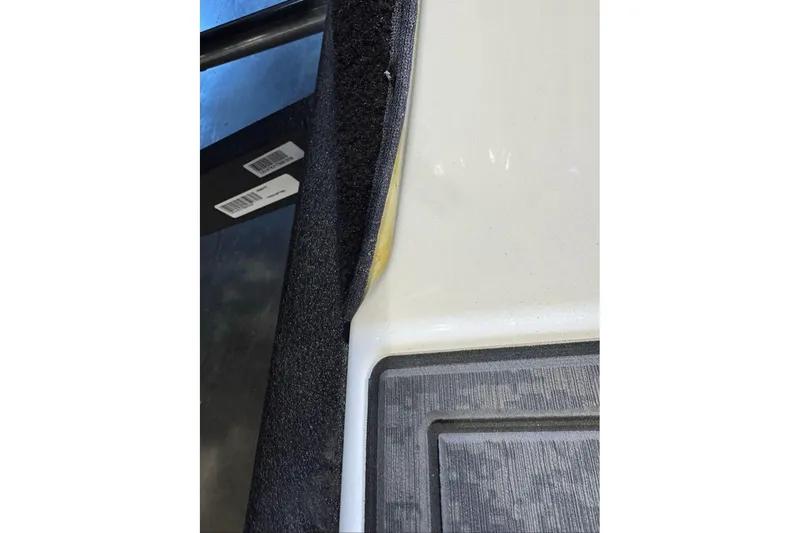 Slide: The Image of 2026 Nitro Z19 XL boat interior detail with carpet and fiberglass components. - 96