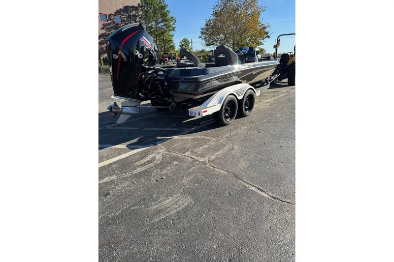 Slide: The Image of 2026 Nitro Z19 XL boat on trailer in parking lot, sunny day. - 12