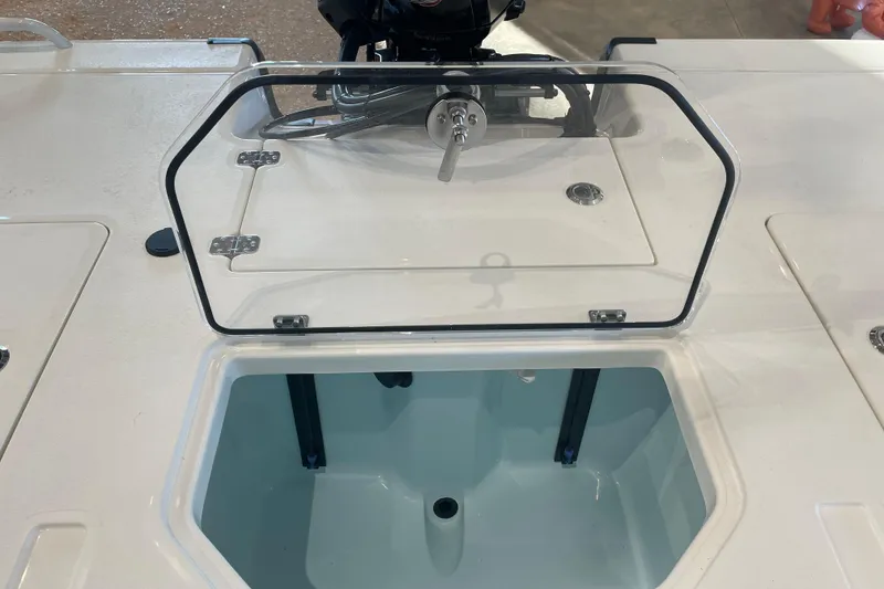 Slide: The Image of 2026 Mako 18 Pro Skiff livewell with open lid, showcasing interior design. - 3