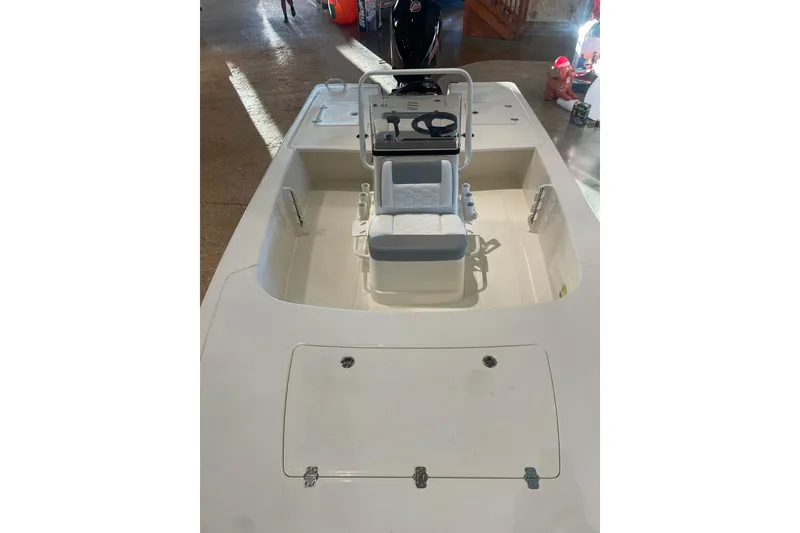 Slide: The Image of 2026 Mako 18 Pro Skiff boat interior with seating and console. - 4