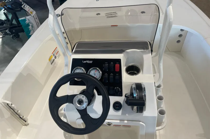 Slide: The Image of Steering console of 2026 Mako 18 Pro Skiff boat with gauges and controls. - 6