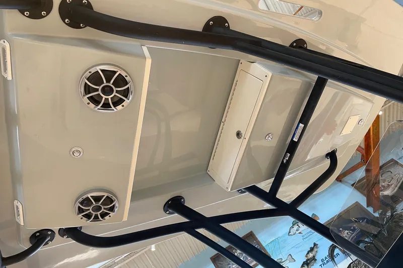 Slide: The Image of 2026 Mako 24 APEX boat interior with speakers and storage compartments. - 6