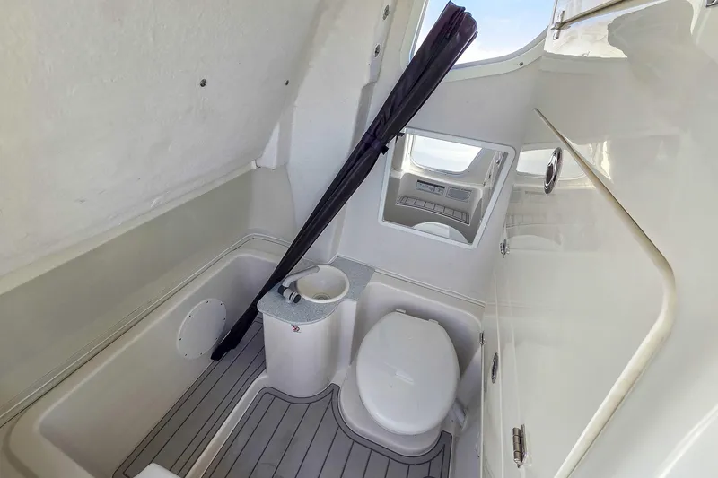 Slide: The Image of 2026 Sea Fox 268 Commander boat interior with compact bathroom and toilet. - 19