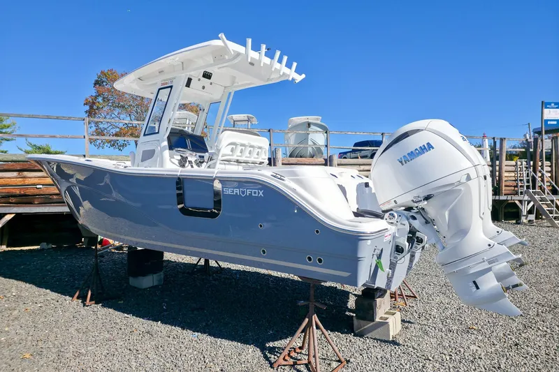 Slide: The Image of 2026 Sea Fox 268 Commander boat with Yamaha engine on display outdoors. - 3