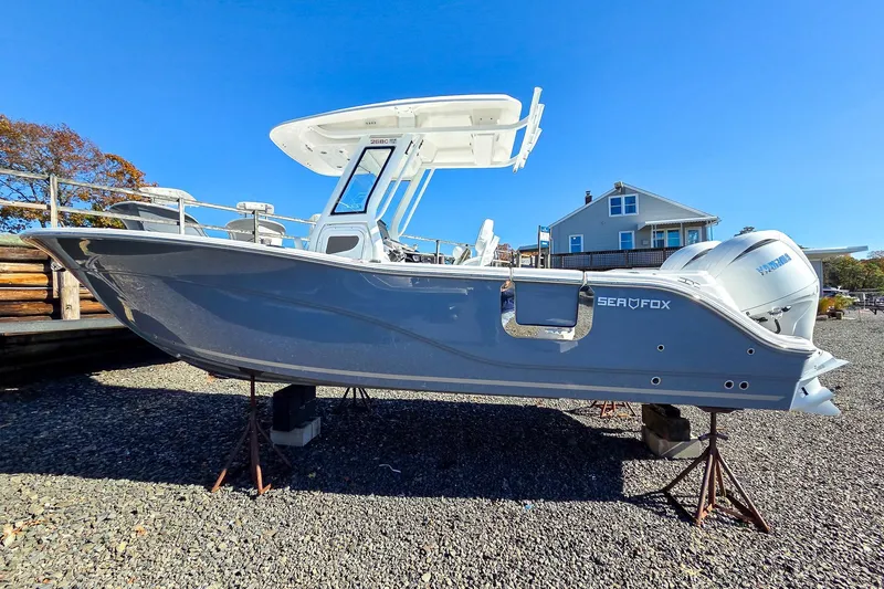 Slide: The Image of 2026 Sea Fox 268 Commander boat on stands, clear sky background. - 5