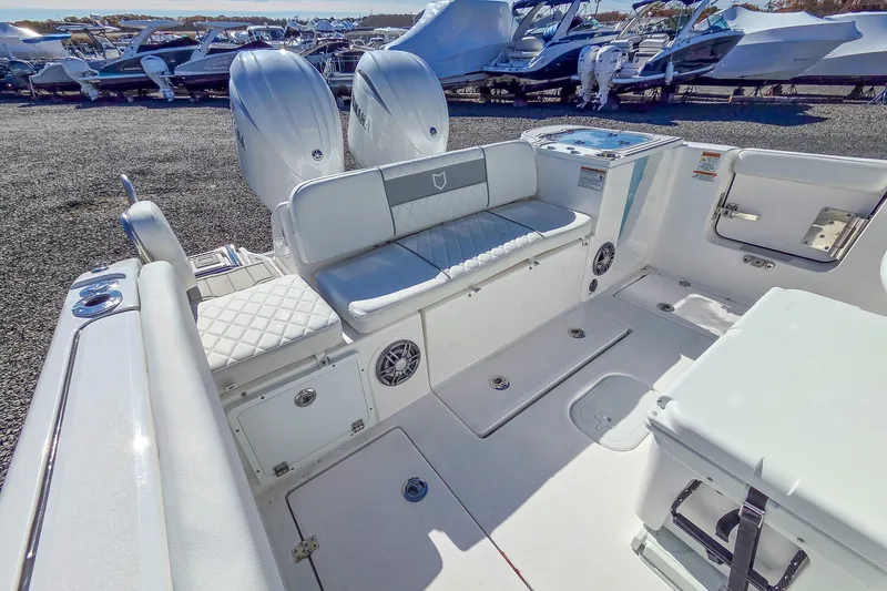 Slide: The Image of 2026 Sea Fox 268 Commander boat interior with seating and dual engines. - 6