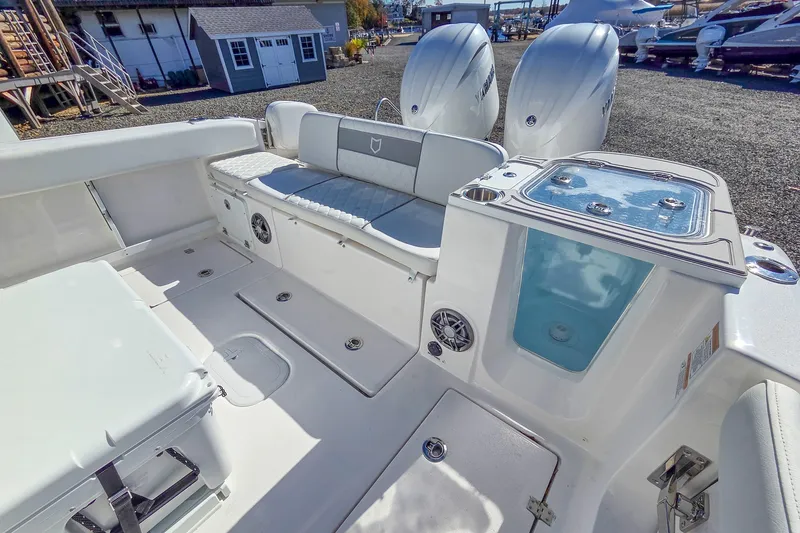 Slide: The Image of 2026 Sea Fox 268 Commander boat interior with seating and dual outboard motors. - 7