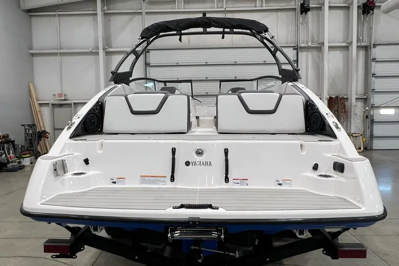 Slide: The Image of 2025 Yamaha Boats AR250, rear view in a garage setting. - 3